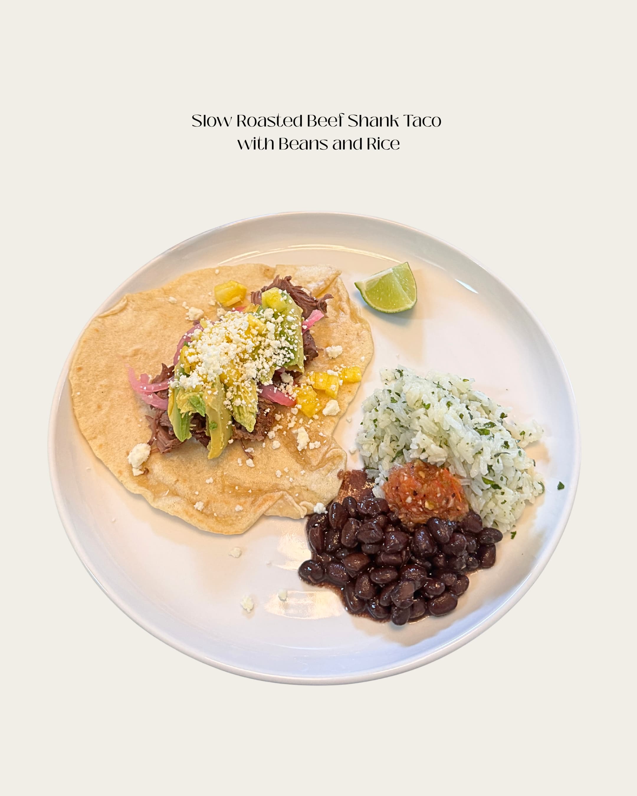 Slow-roasted beef shank taco with beans and rice